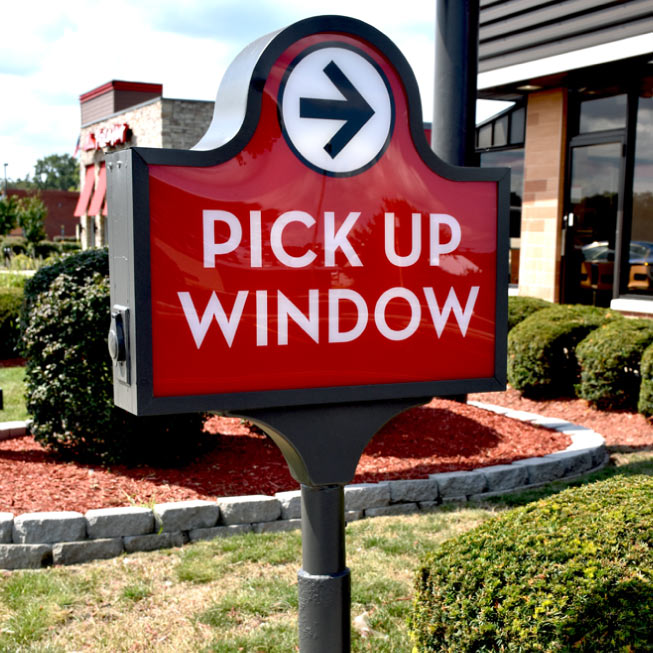 Restaurant parking directional sign.
